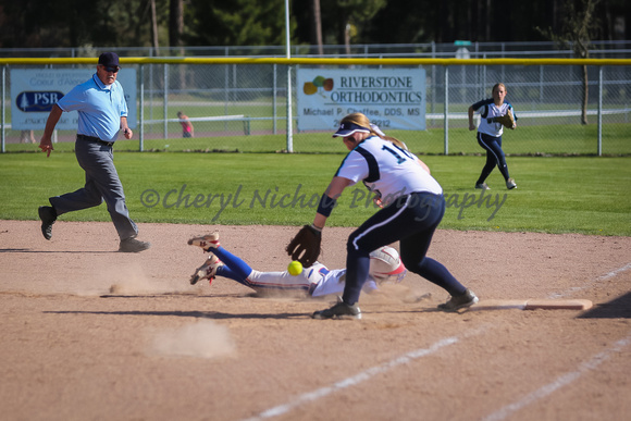 Ky Smith diving back to first base
